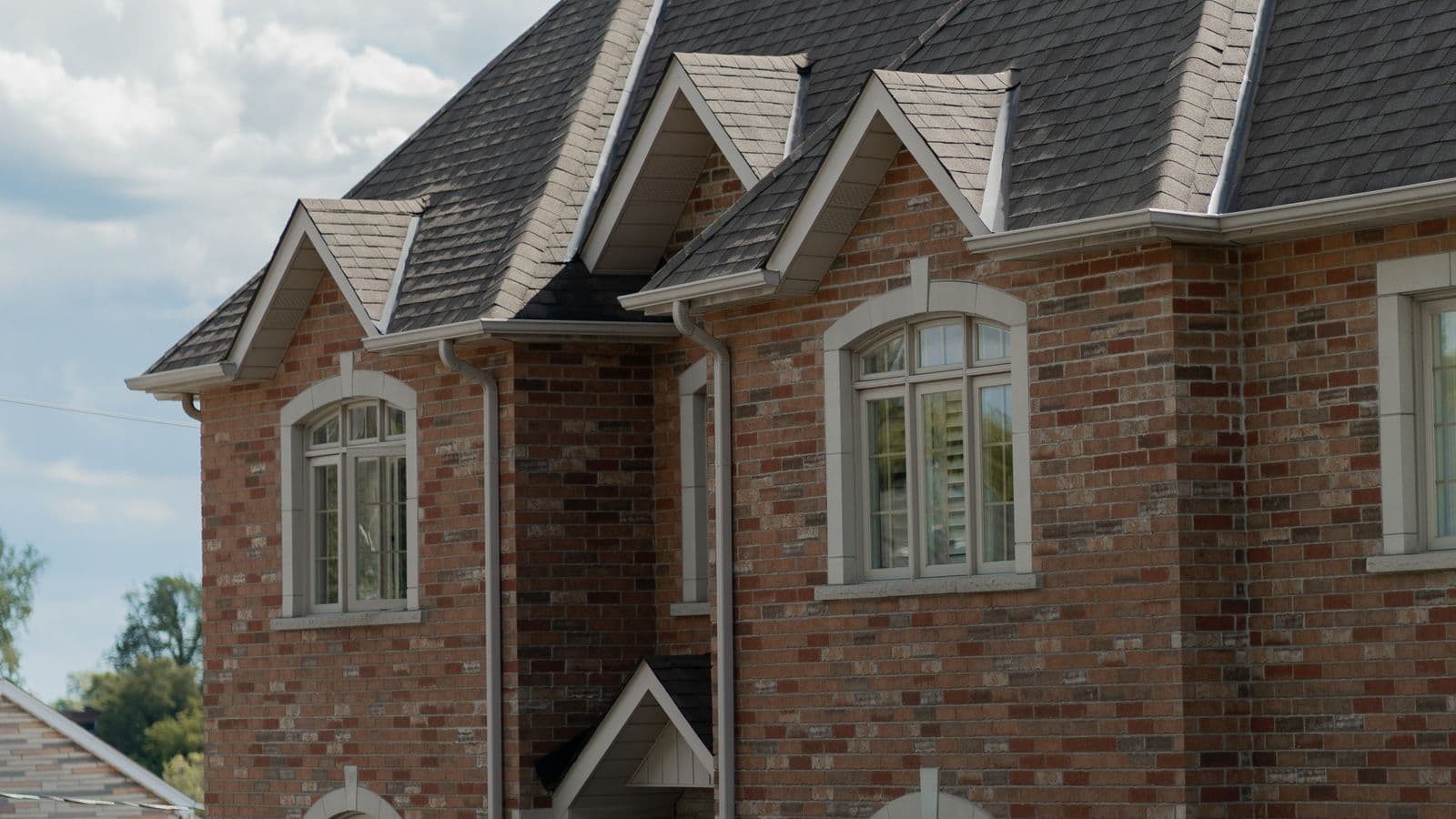 Traditional brick family home with gabled roof, the kind of house heirs often inherit
